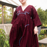 The Double Take Dress in Berry Linen with ribbon appliquè