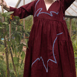 The Double Take Dress in Berry Linen with ribbon appliquè
